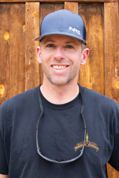 Fish standing in front of wood wall