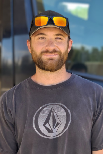 Nick standing in front of van