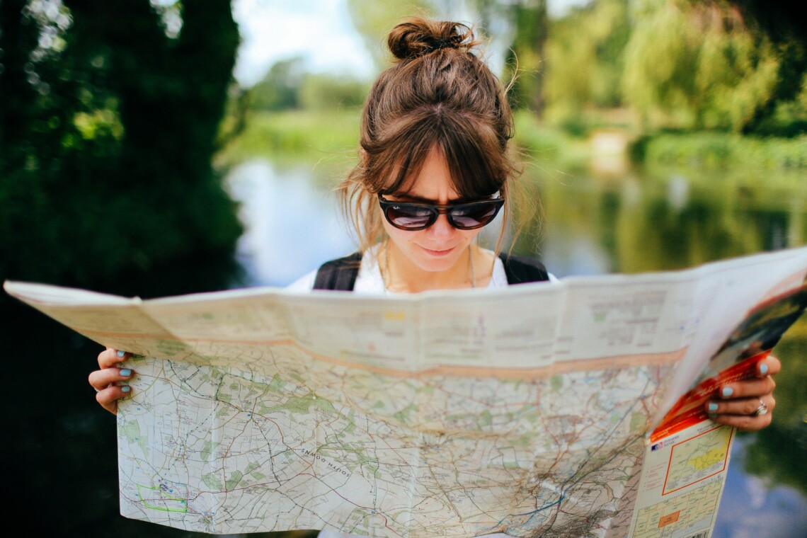 woman reading map