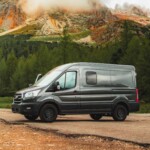 ford transit van in front of mountain