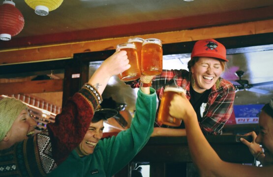 Group of friends toasting beer