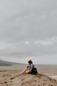 woman looking at camera on sand dunes